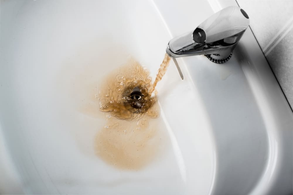 a water coming out of a faucet