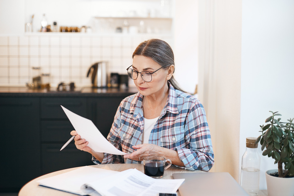 Lady looking at a bill