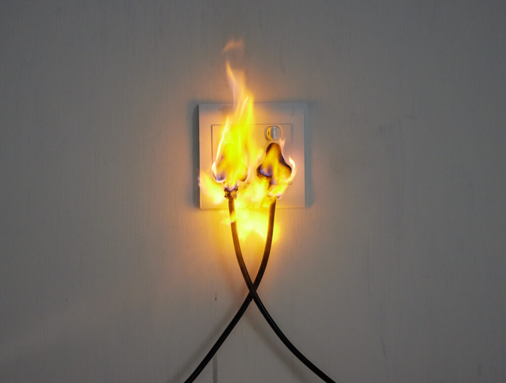 Electricity, flame and plug on wall of home with space for accident, connection or emergency. Cable, fire or insurance and socket in apartment for danger, power or safety with electrical current.